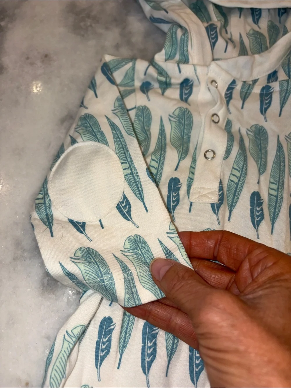 kate quinn Hooded Baby Romper in Teal and Aqua Feather Print